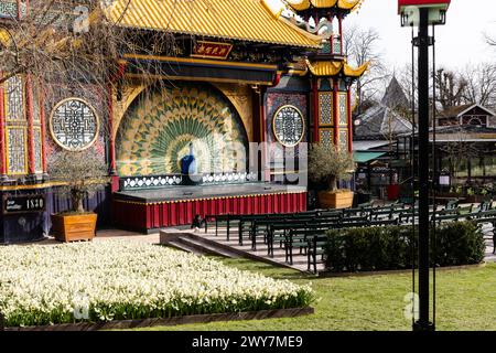 Chinese-style pantomime theatre with large peacock and empty theater ...