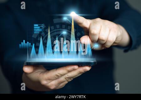 The businessman notes high rates of growth and success. Business analytics and planning. Working with statistical data. High performance, growth indic Stock Photo