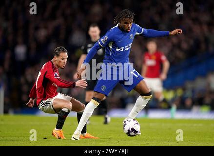 Manchester United's Antony (left) and Chelsea's Carney Chukwuemeka in action during the Premier League match at Stamford Bridge, London. Picture date: Thursday April 4, 2024. Stock Photo