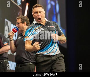 Gerwyn Price celebrates winning the final against Luke Littler during ...