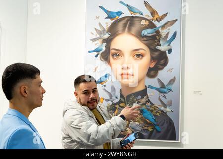 New York, NY, USA. 4th Apr, 2024. Artexpo New York opened in Pier 39 on the Lower East Side, with galleries and artists showing contemporary art to an engaged audience. Visitors to Art Projects USAA, with a painting by Carola Orieta-Sperman. Credit: Ed Lefkowicz/Alamy Live News Stock Photo