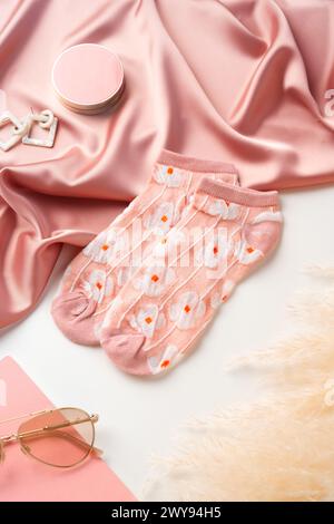 Pink socks with pattern on white background Stock Photo
