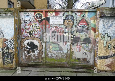 Colourfully painted gate to a driveway, Bremen, Germany Stock Photo