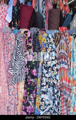 Small business in Cabramatta, Western Sydney, colourful rolls of fabrics displayed in front of a dressmaker's fabric store Stock Photo