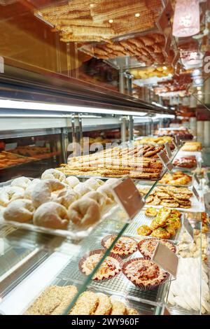 Delectable Assortment of Pastries and Sweets on Display at a Bakery Shop Stock Photo