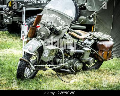 SAINTE MERE L'EGLISE, NORMANDY, FRANCE - JUNE 6 2023. Second world war commemoration. Military camp reconstitution Military vintage motorbike used for Stock Photo