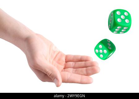 Man throwing green dice on white background, closeup Stock Photo