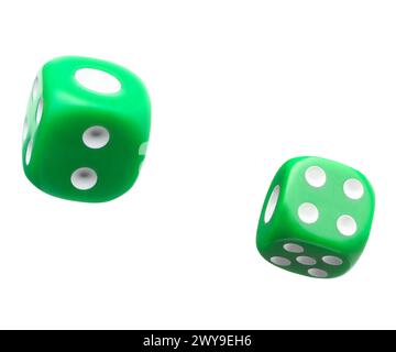 Two green dice in air on white background Stock Photo