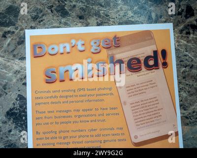 Don't Get Smished warning leaflet; smishing is a phishing cybersecurity attack carried out over mobile text messaging. Stock Photo