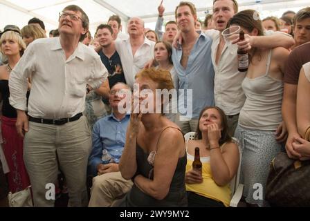 World Cup Football 2006. England v Portugal. The penalty shoot out England went on to lose. Fans photographed in beer tent marquee watching the football game on specially erected televisions sets. Oxfordshire UK 2000s HOMER SYKES. Stock Photo