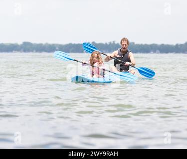 Father-Daughter Kayaking in Syracuse, Indiana. Stock Photo