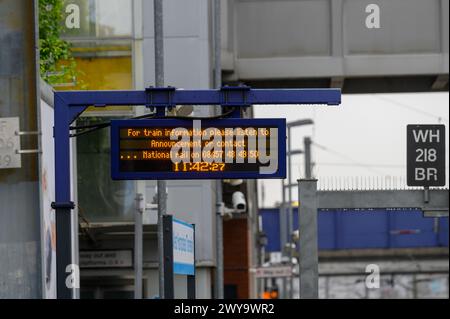 Digital information display on a railway station platform, West Hampstead station, London, England. Stock Photo