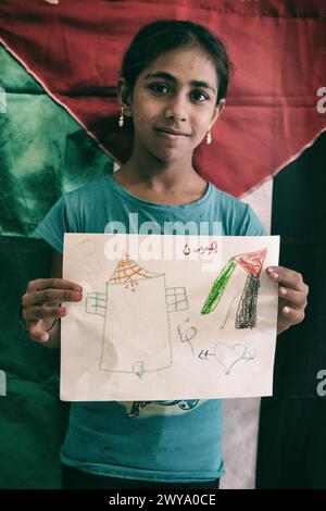 Palestinian kids from school showing their vision of Palestine during a drawing exercice. Sabra-shatila refugee camp in Lebanon Stock Photo