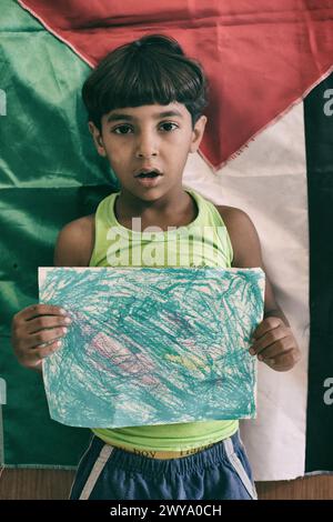 Palestinian kids from school showing their vision of Palestine during a drawing exercice. Sabra-shatila refugee camp in Lebanon Stock Photo