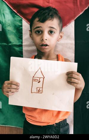 Palestinian kids from school showing their vision of Palestine during a drawing exercice. Sabra-shatila refugee camp in Lebanon Stock Photo