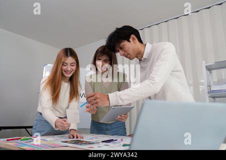 Brainstorm team of creative web graphic designer planning. Creative designers present ux ui to team. Designers team working meeting in office Stock Photo