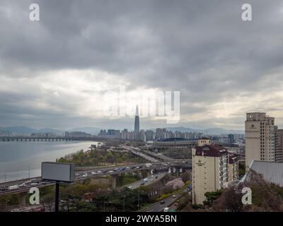 Seoul, South Korea - Olympic Boulevard, Jamsil Olympic Stadium, and Lotte World Tower by the Han River in Seoul. Stock Photo