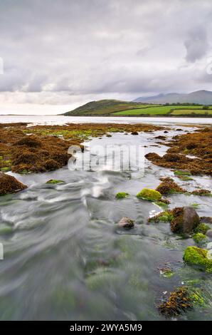 Rocky shore of the Owenmore estuary at Cloghane, County Kerry, Ireland Stock Photo