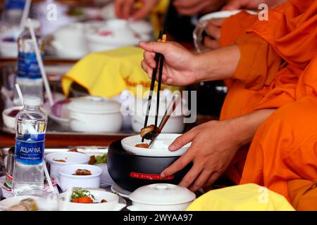 Vegetarian meal, monks at Buddhist ceremony in the main hall, Phuoc Hue Buddhist pagoda, Tan Chau, Vietnam, Indochina, Southeast Asia, Asia Copyright: Stock Photo