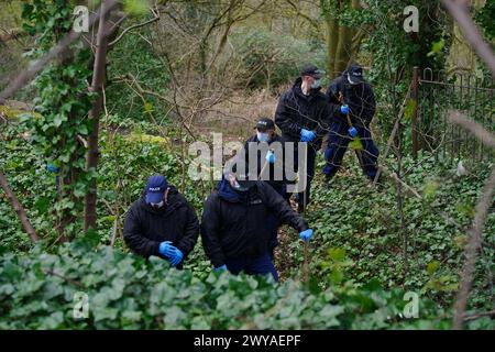 Police officers carry out searches at Kersal Dale, near Salford, Greater Manchester, where a major investigation has been launched after human remains were found on Thursday evening. Greater Manchester Police (GMP) said officers were called by a member of the public who found an 'unknown item wrapped in plastic'. Picture date: Friday April 5, 2024. Stock Photo