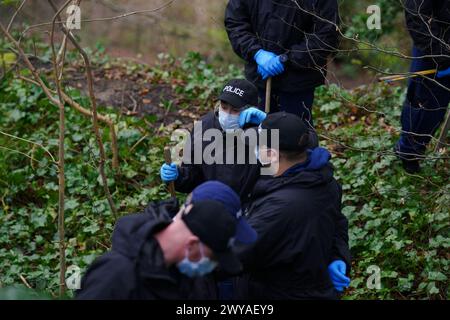 Police officers carry out searches at Kersal Dale, near Salford, Greater Manchester, where a major investigation has been launched after human remains were found on Thursday evening. Greater Manchester Police (GMP) said officers were called by a member of the public who found an 'unknown item wrapped in plastic'. Picture date: Friday April 5, 2024. Stock Photo