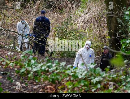 Police and forensic officers at Kersal Dale, near Salford, Greater Manchester, where a major investigation has been launched after human remains were found on Thursday evening. Greater Manchester Police (GMP) said officers were called by a member of the public who found an 'unknown item wrapped in plastic'. Picture date: Friday April 5, 2024. Stock Photo