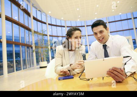 Executives with digital tablet, video conference. Stock Photo