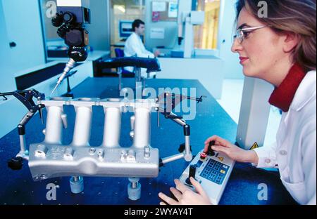 High precision metrology, coordinate measuring machine, aluminum car engine component. Stock Photo