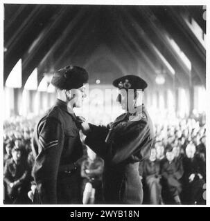 51 HIGHLAND DIVISION INVESTITURE - Original wartime caption: Cpl. W. Cunningham, 1 Gordons, receives the MM. 3248713 Photographic negative , British Army, 21st Army Group Stock Photo