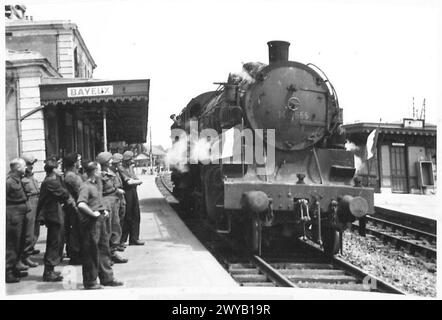 BRITISH REs DRIVE FIRST FRENCH ENGINE - Original wartime caption: The locomotive in Bayeux station at the completion of the run. Photographic negative , British Army, 21st Army Group Stock Photo