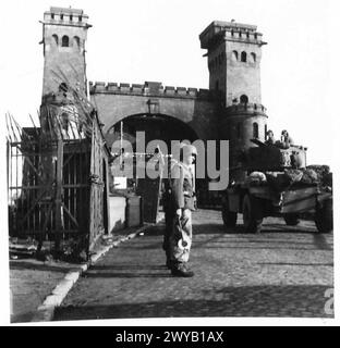 BRITISH TROOPS ON THEIR WAY TO COPENHAGEN - Original wartime caption: British armoured cars passing over the Kiel Canal bridge. Photographic negative , British Army, 21st Army Group Stock Photo