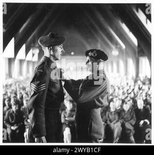 51 HIGHLAND DIVISION INVESTITURE - Original wartime caption: Sgt. H. Platts, 7 A & S.H. receives the MM. 2990636 Photographic negative , British Army, 21st Army Group Stock Photo