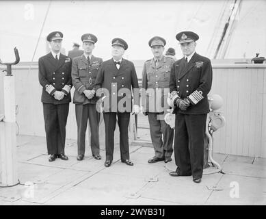 CANADA BOUND; CHURCHILL'S ATLANTIC CROSSING. AUGUST 1943, AT SEA, MR WINSTON CHURCHILL AND HIS PARTY MAKING THE ATLANTIC CROSSING FOR THE CONFERENCE IN CANADA. - Group on the bridge (left to right): Admiral Mountbatten (Chief of Combined Operations), Air Chief Marshal Sir Charles Portal, Mr Churchill, General Sir Alan Brooke and Admiral of the Fleet Sir Dudley Pound. , Stock Photo