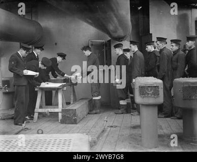 SCENES ON BOARD A BATTLESHIP AT SEA. 1940 OR 1941, ON BOARD HMS NELSON. - Pay day in a battleship. , Stock Photo