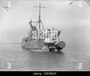 BOOM DEFENCE. OCTOBER 1941, ROSYTH. MEN WHO ARE USED TO HANDLING ...