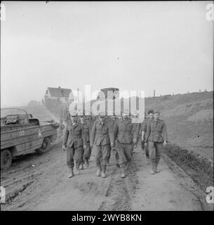 A long column of German prisoners of war is captured on the outskirts ...