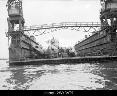 BRITISH NAVY TAKES OVER AT KIEL. 12 MAY 1945, KIEL. THE ROYAL NAVY TRAVELLING OVERLAND FROM OSTEN TOOK OVER THE GERMAN NAVAL PORT AND DOCKYARD AT THE SOUTHERN END OF KIEL BAY. - Type 23 prefabricated U-boats in the floating dock. , Stock Photo