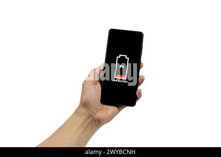 Cellular Problems and Energy Concepts. Man hand holding smart phone with low battery icon on screen isolated on white background. All screen graphics Stock Photo