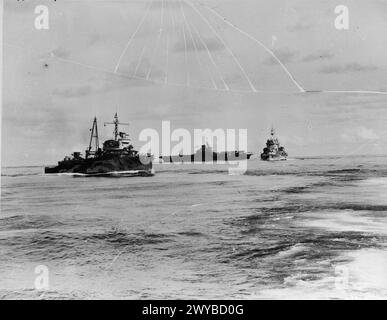 SHIPS OF THE EASTERN FLEET. AUGUST 1942, ON BOARD HMS MAURITIUS. - Left to right: Dutch cruiser HEEMSKERK, aircraft carrier HMS ILLUSTRIOUS, and the battleship HMS WARSPITE. , Stock Photo