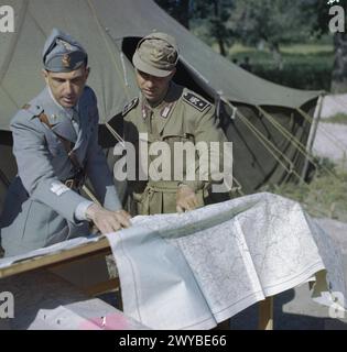 HRH PRINCE UMBERTO OF ITALY, MAY 1944 - HRH Prince Umberto conferring with officers over a map table at an Italian camp during his visit to the Italian Corps of Liberation, Sparanise, Italy. , Umberto II, King of Italy, Italian Army Stock Photo