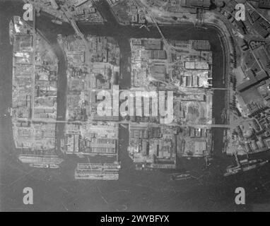 ROYAL AIR FORCE: OPERATIONS BY THE PHOTOGRAPHIC RECONNAISSANCE UNITS, 1939-1945. - Part of a vertical photographic-reconnaissance aerial taken over Hamburg, Germany after major raids by aircraft of Bomber Command on the nights of 27/28 July and 29/30 July 1943, showing the devastated shipyard of H C Stulken Sohn, and other warehouses and storage buildings in the Steinwarder-Waltershof district. , Royal Air Force, Expeditionary Air Wing, 902 Stock Photo