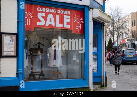 Closing down sale at the Pates Menswear shop, another example of the decline of the UK high street on 2nd April 2024 in Gloucester, United Kingdom. Gloucester city centre is an example of the decline of the UK high street and what some local people are calling a ‘dying city’ as more big name retailers move out and retail spaces close down, having an affect on jobs in the area. Several contributing factors are aligning to result in declining high streets, including the cost of living crisis squeeze on household incomes due to inflation and the post-Brexit fall in the pound, a shift to online sh Stock Photo