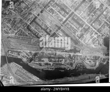 ROYAL AIR FORCE: OPERATIONS BY THE PHOTOGRAPHIC RECONNAISSANCE UNITS, 1939-1945. - Part of a vertical photographic-reconnaissance aerial taken over Hamburg, Germany after major raids by aircraft of Bomber Command on the nights of 27/28 July and 29/30 July 1943. Devastation and severe damage to buildings and marshalling yards in the St Georg dockside district. , Royal Air Force, Expeditionary Air Wing, 902 Stock Photo