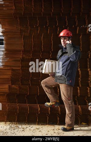 Architect, corrugated iron for formwork, housing construction. Stock Photo