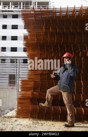 Architect, corrugated iron for formwork, housing construction. Stock Photo