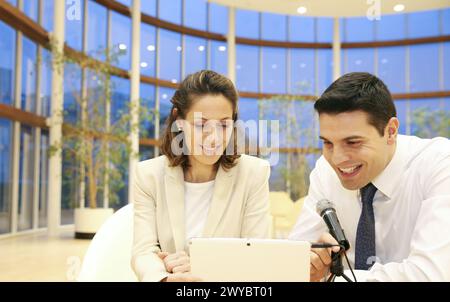 Executives with digital tablet, video conference. Stock Photo