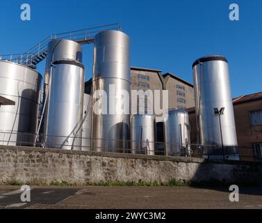 Large stainless steel storage tanks at the cooperative winery in Montefiascone, Lazio Region, Italy. April 1st-4th, 2024 Stock Photo