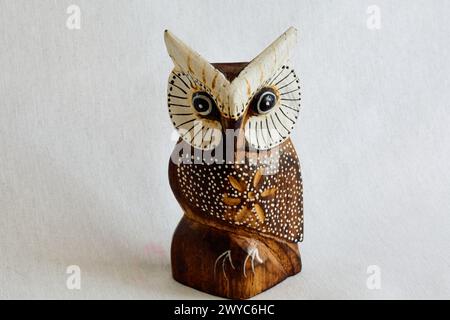Feng Shui multi-colored owl figurine made of wood Stock Photo