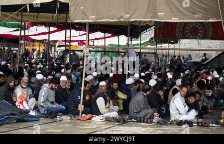 Muslim women gather outside a mosque after attending morning prayers ...