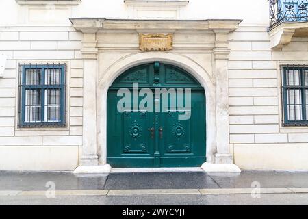 VIENNA, AUSTRIA - MAY 22, 2019: This is a wooden carved gate in an 18th-century apartment building in the Inner City district. Stock Photo